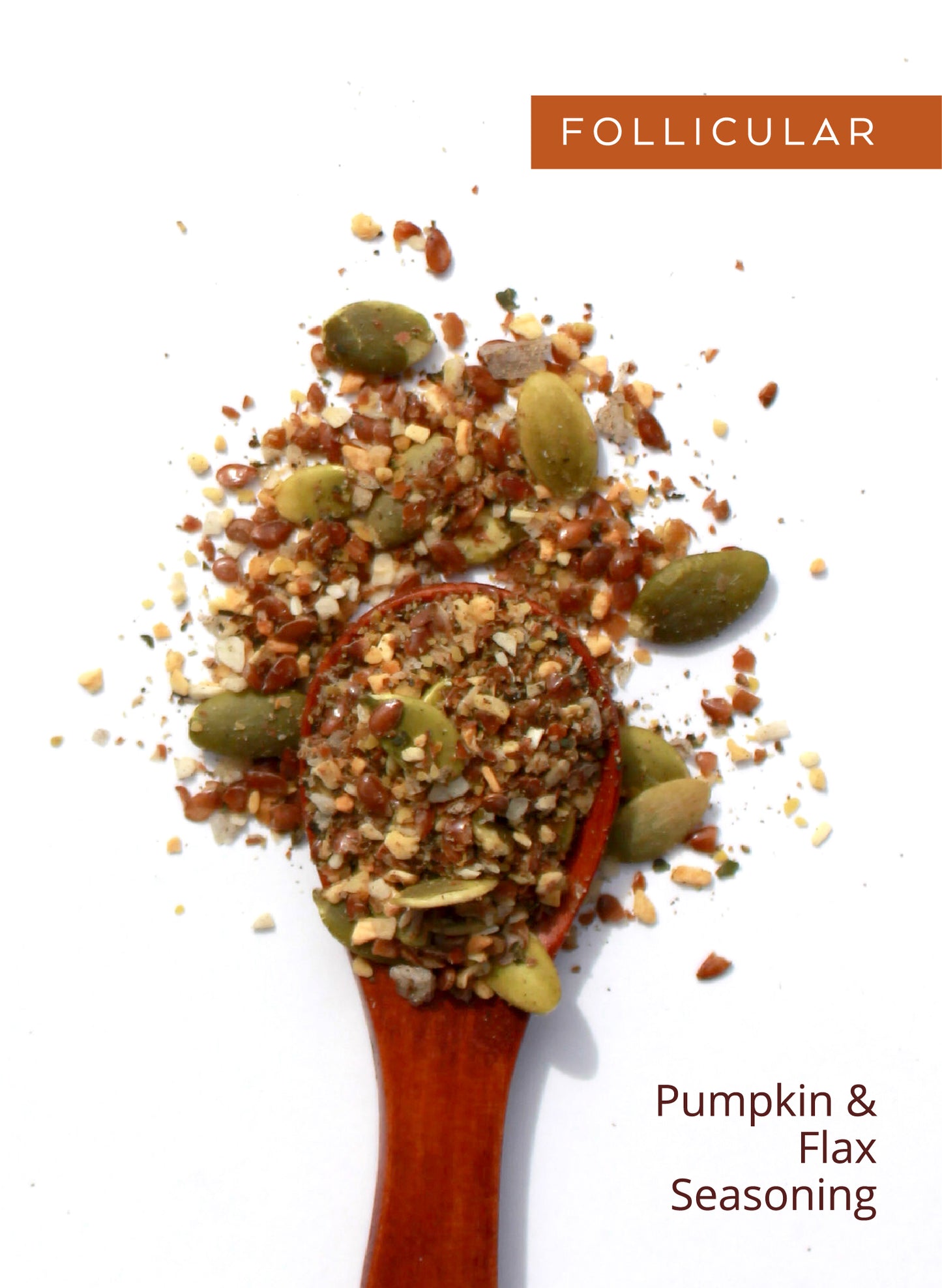 Wooden spoon of Follicular seed blend, labeled “Pumpkin & Flax Seasoning.”